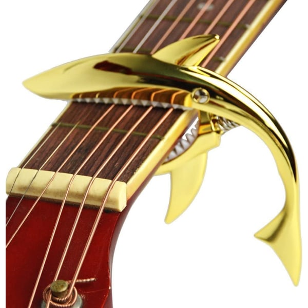 Sinkkiseoksesta valmistettu kitara Capo Shark Capo akustiselle ja sähkökitaralle, jossa on hyvä käsituntuma, ei kiukkua ja kestävä (kulta)