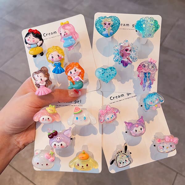 Børns lysende ring, tegneseriering til piger, fødselsdag Sanrio + Elsa - 10-pack Glowing ring