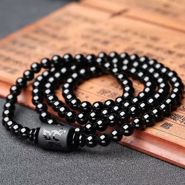 Armband i kristall obsidian med cylindriska drak-totem pärlor
