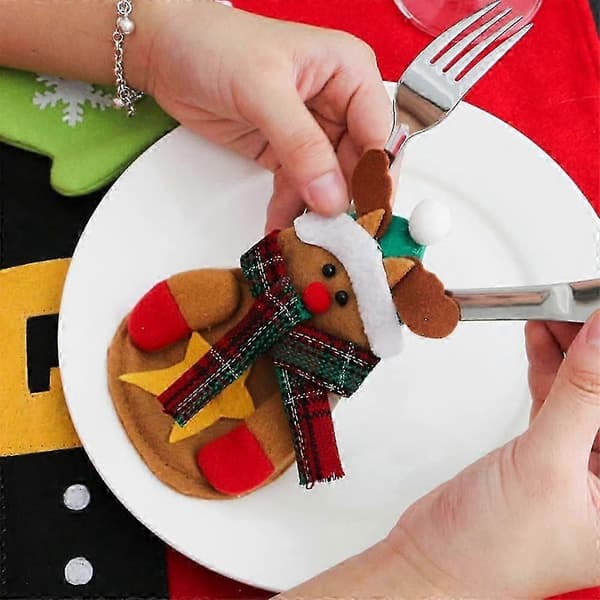 Bestickfickor med jultema (tomte och snögubbe) för dukningen (Peng)