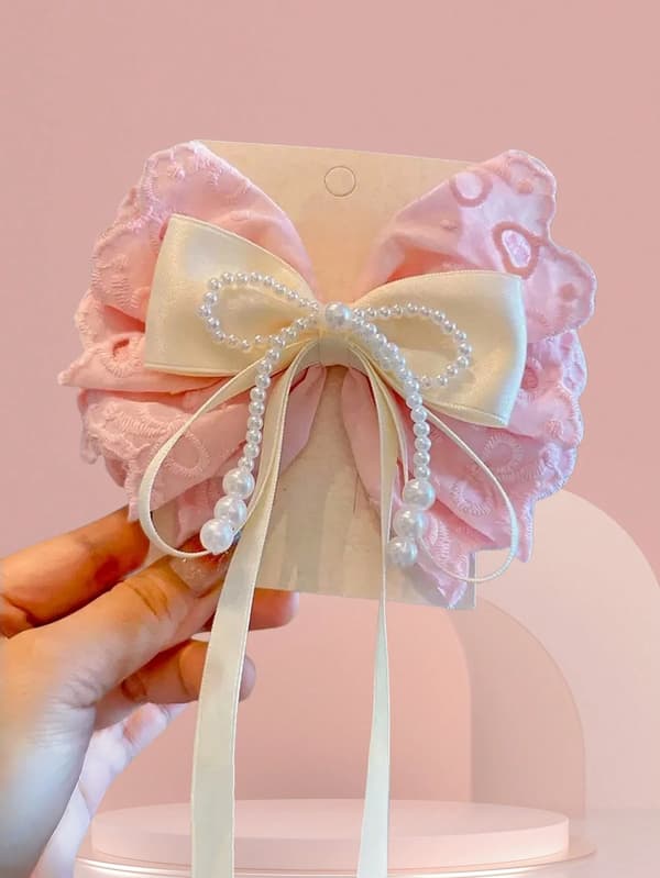 Flickhårklämma med rosett, spets och pärldetaljer Pink