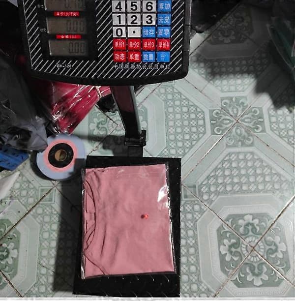 Damtopp med löst, ribbad ärmlös linne i rosa M rose red M