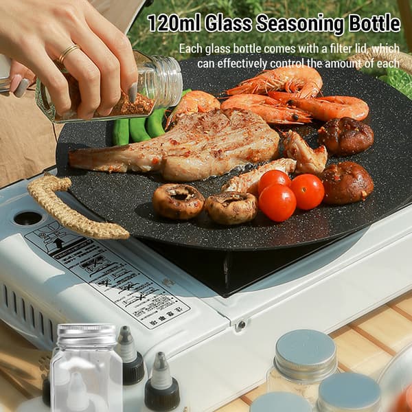 Bärbart campingkryddset med glas- och plastflaskor och förvaringsväska