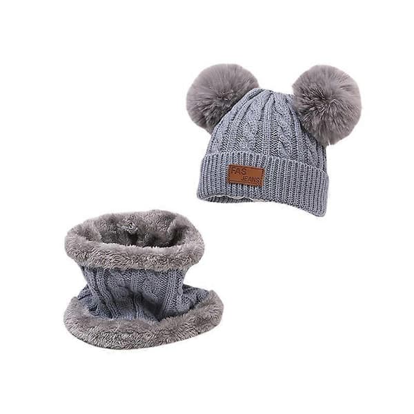 Et sett med damehatt og skjerf Vinterlue med dusk Tykk varm