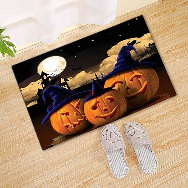 Hauska Halloween-ovimatto kurpitsoja noidanhatussa ovikoristeidea
