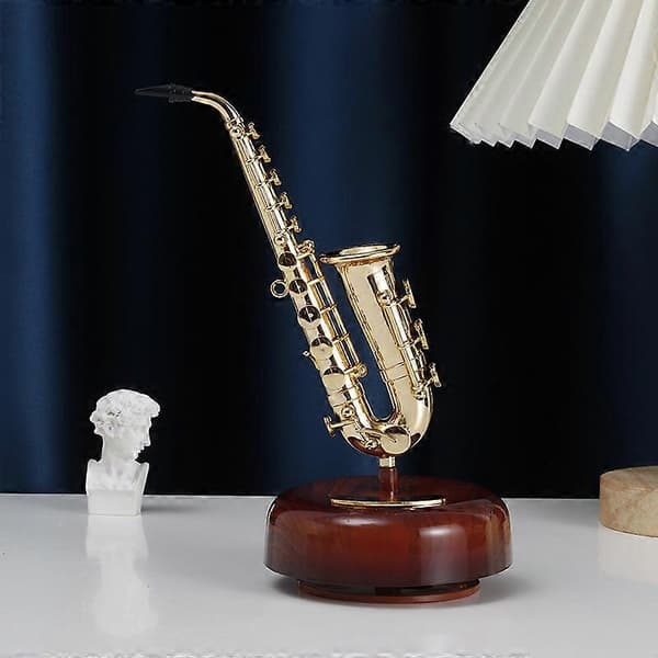Spilledåse klassisk saxofon fransk statue retro håndsvinget mu