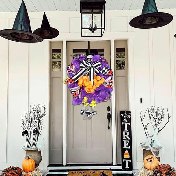 Halloween skräckskalleskelettdörrkrans med randig pilbåge