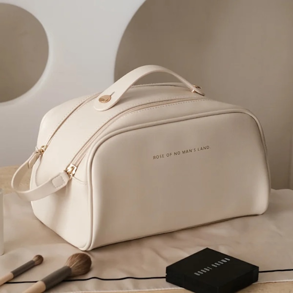 Mini cosmetics bag in solid leather white