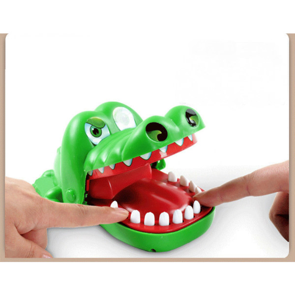 Lasten lelu puree sormea ​​krokotiili