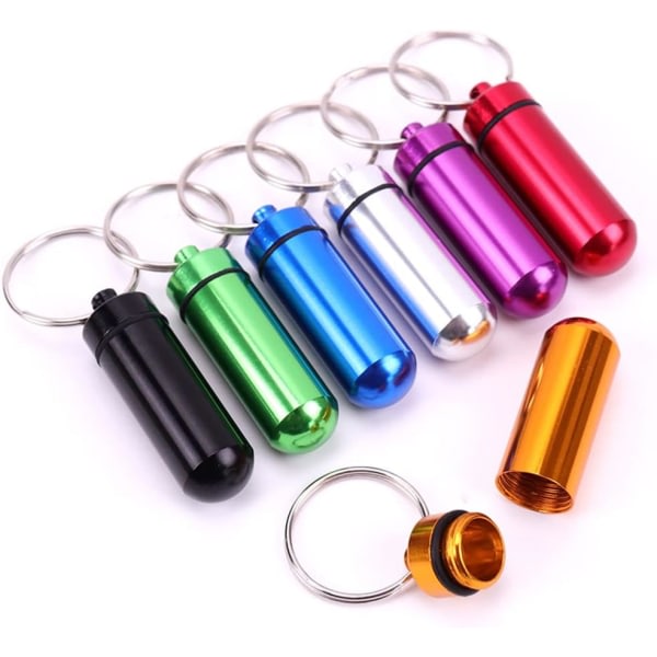 7 st Bärbar Mini Pill Organizer Läcksäker aluminiumlegering Piller Flaska 7 färger på 7 dagar IC