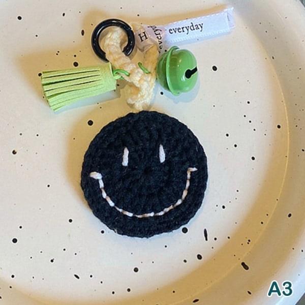 IC Mode e Smile Face Nøgleringe Med Klokke Kvinder Strikning Smilende A3