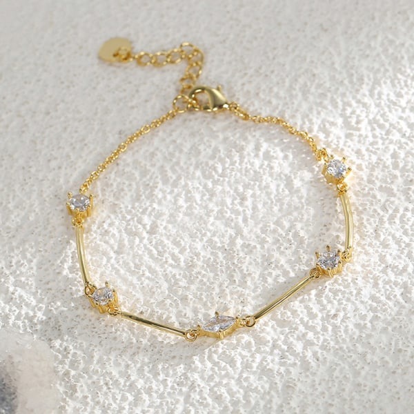 Guld armband för kvinnor