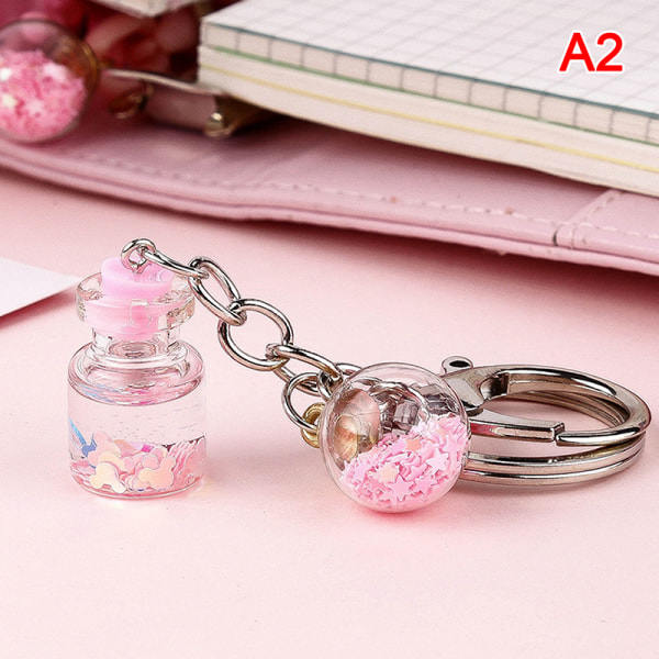 IC Ny trendig e Flower Quicksand Bottle Keychain Creative Keyring Pink