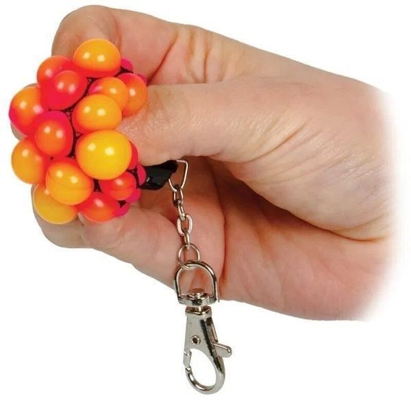 Anti-stress nøglering med afslappende pustebold * Mål: 5 x 3 x 3 cm * Farve: tilfældig Funktioner: nøglering, IC