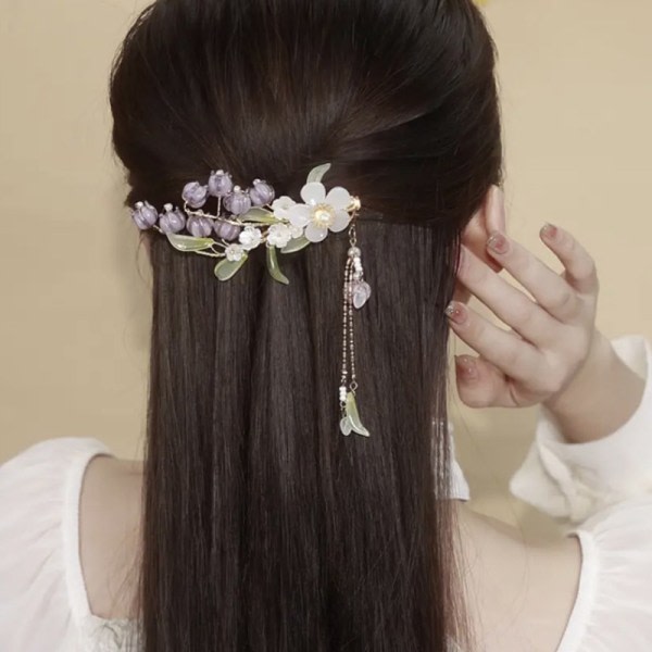Elegant lila blomsterhårklämma med tofsar för kvinnor