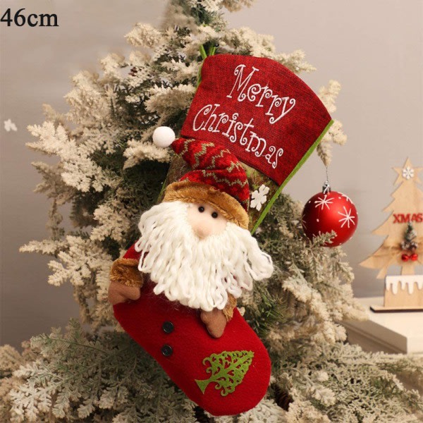 IC Julstrumpa med hängande jultomten tecknad godissäck