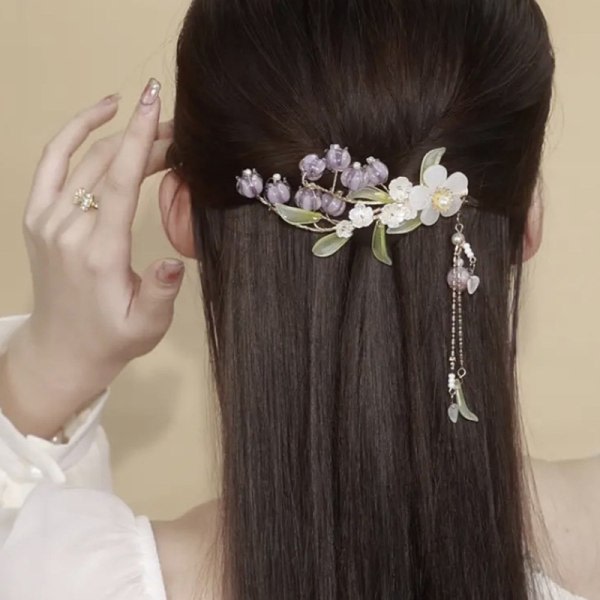 Elegant lila blomsterhårklämma med tofsar för kvinnor
