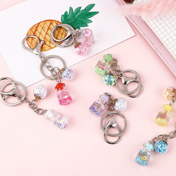 IC Ny trendig e Flower Quicksand Bottle Keychain Creative Keyring Rosa