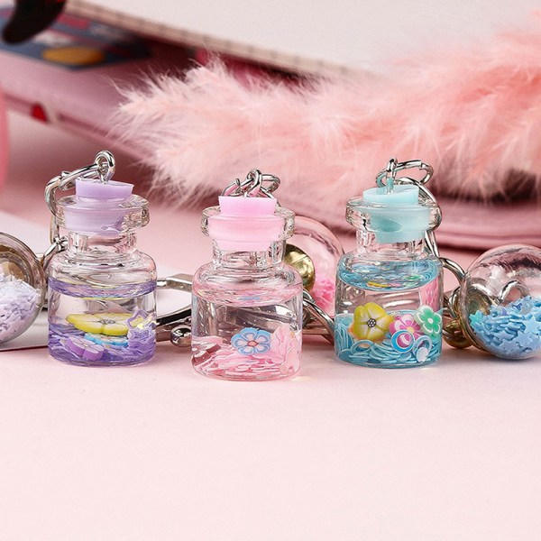 IC Ny trendig e Flower Quicksand Bottle Keychain Creative Keyring Pink