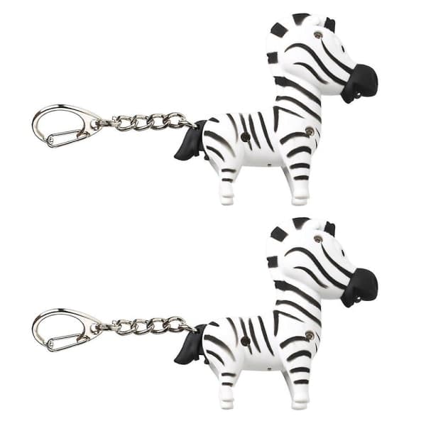 2 stk Zebraformede LED-lyd og glødende nøgleringe Nøglevedhæng (tilfældig stil) IC