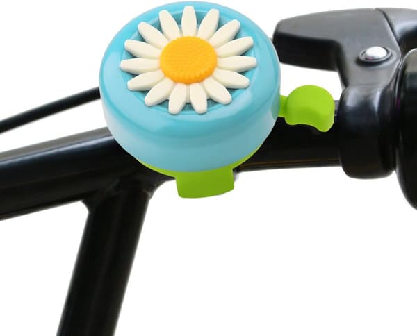 Flickcykelklocka, fräsch ljusgrön, prydd med ett vackert band.
