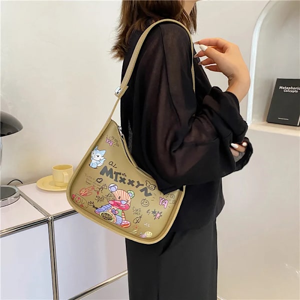 Cartoon Graffiti PU Läder Armhåla Axelväskor För Kvinnor Mode Ny Kvinnors Designer Crossbody Bag Lyxmärke Handväska Black 24cmx18cmx7cm