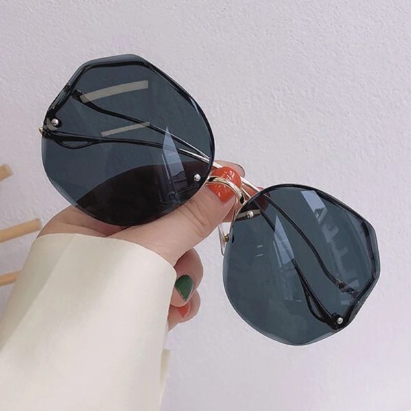Oregelbundna runda solglasögon Kvinna Märkesdesigner Gradient Mode Solglasögon Kvinnlig båglös metall Böjda tempel Oculos De Sol Gold Gray other