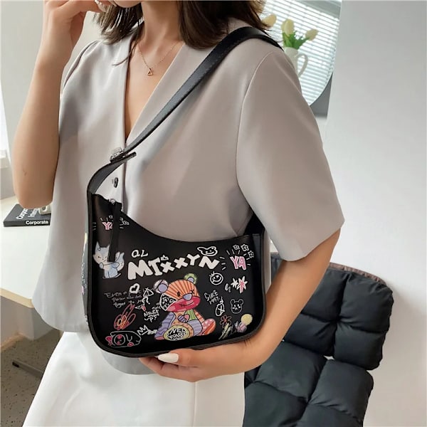Cartoon Graffiti PU Läder Armhåla Axelväskor För Kvinnor Mode Ny Kvinnors Designer Crossbody Bag Lyxmärke Handväska White 24cmx18cmx7cm