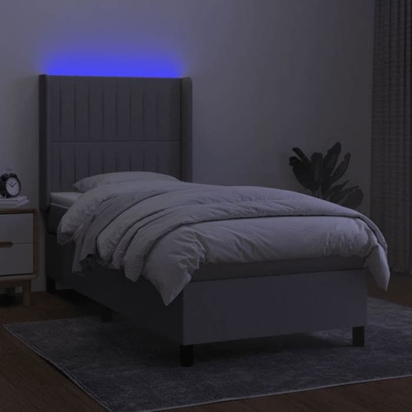 LED-sängyn runko harmaalla kankaalla, päädyn patja 90 x 190.