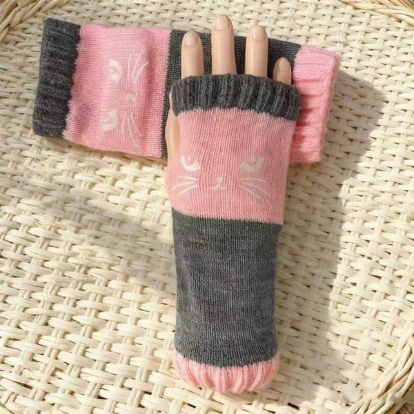 Søde strikkede fingerløse handsker til kvinder til vinter, med et kattemønster, for at holde dine hænder varme. pink