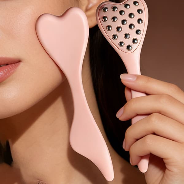 20-perle Ansigtsmassager i Rustfrit Stål med Kuldeterapi, Hjerteformet Massager til Ansigts- og Øjenpleje Pink