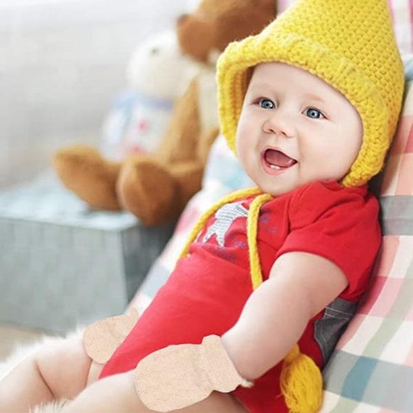 Baby bomullshandskar kan justeras för att förhindra att ansiktet repas