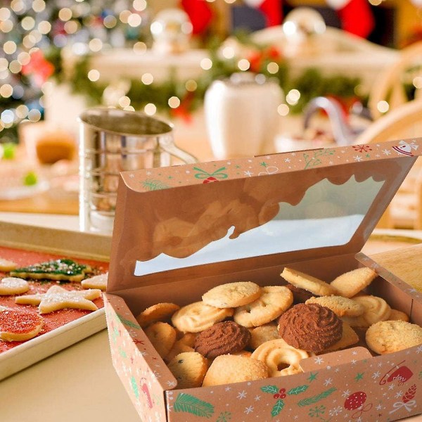 12 pakkaa joulukeksirasiaa ikkunalla, suuria juhlaruokaleipomon herkkupakkauksia lahjan antamiseen, leivonnaisia, karkkeja, juhlatarjoja, joulun Kraft-lahja B