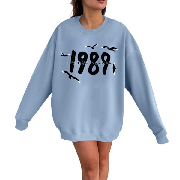 Taylor Swift laulaja Taylor Swift 2D samettiprintillä varustettu naisten pyöreäkauluksinen collegepaita light blue XL