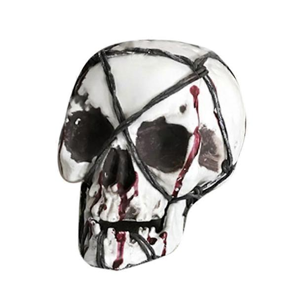 Pelottava verinen rautalangalla kääritty kalloluuranko aavemaisen talon sisustus Halloween-rekvisiitta