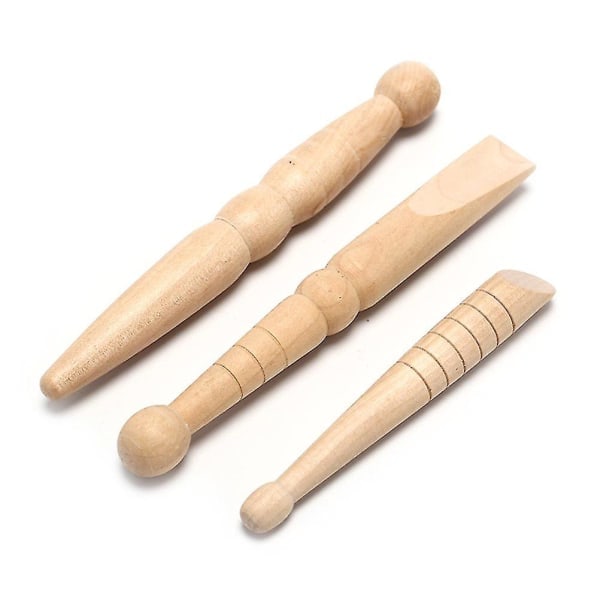 3 massage sticks made of wood as help for reflex points