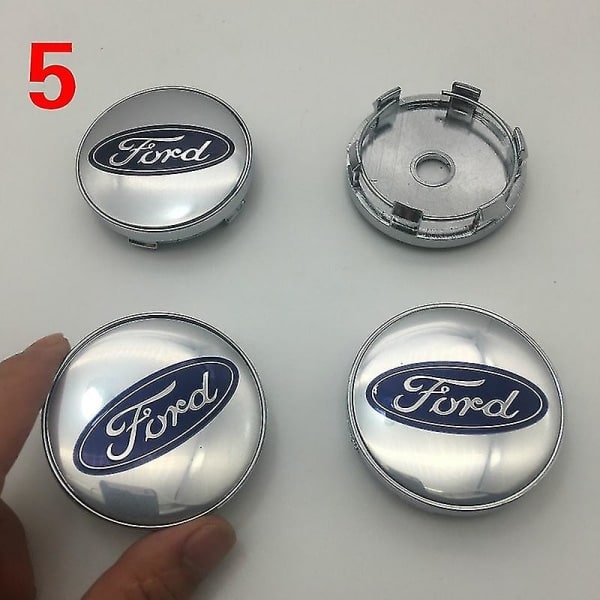 4 kpl 60 mm keskiöhattua Skodalle, Fordille, Opelille, Peugeotille, Volvolle ja Cadillacelle