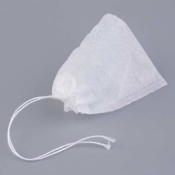 100 kpl Elintarviketurvallisia Kuitukangasteepusseja Teesuodatinpusseja Mausteteetä Varten Infuser Narulla Lämmönsulkeminen Maustesuodatin Teepussit 6*8cm