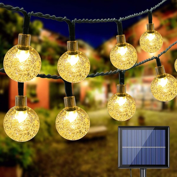 LED solgarland 30 bollar (6,50m) - mörkgrön tråd, svart batteri och solenergiladdning, transparent boll, ljus vit-svart