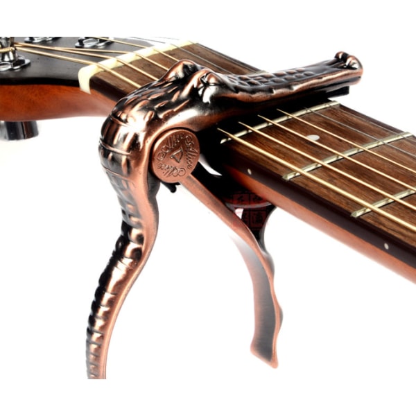 Guitar Kapo krokodilklämma tillbehör är kompatibla med den ursprungliga balladen elgitarr Copper