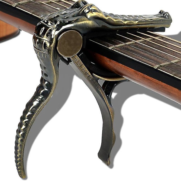 Guitar Kapo krokodilklämma tillbehör är kompatibla med den ursprungliga balladen elgitarr Copper