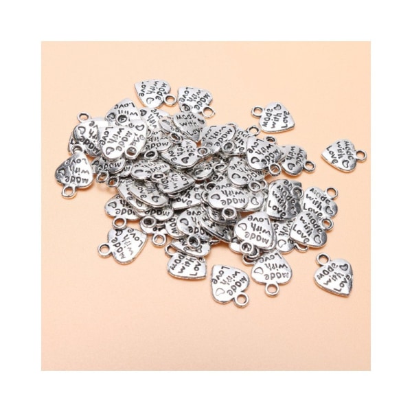 Förpackning med 60 antika silverhjärtaberlocker med kärleksberlocker för gör-det-själv-hantverk Smycketillbehör