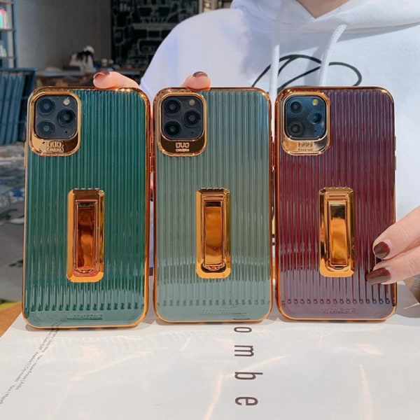 iPhone 11 Stilrent lyxigt skal med gulddetaljer och fällbart stä Röd one size