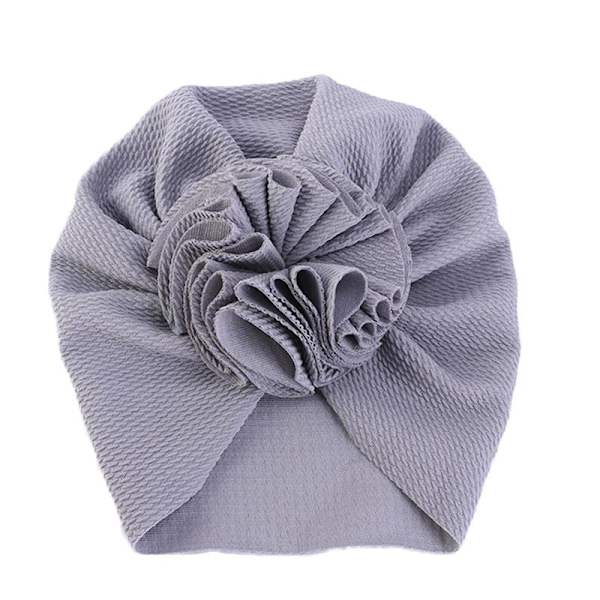 Suloinen turbaani, jossa iso kukka useissa väreissä stretchmateriaalia 0-4 v vauva lapsi Grey one size