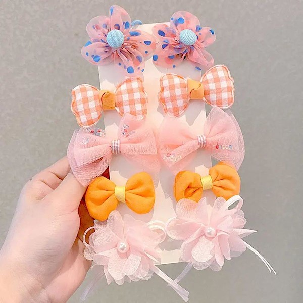 Sarja värikkäitä rusetteja hiusklipsikukkia ja helmiä Pink one size