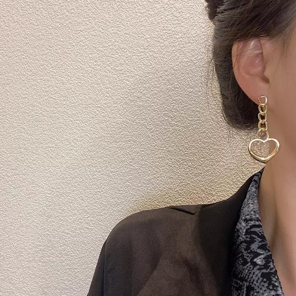 Söpöt korvakorut, joissa sydän ja ketju roikkuvat pitkät Gold one size