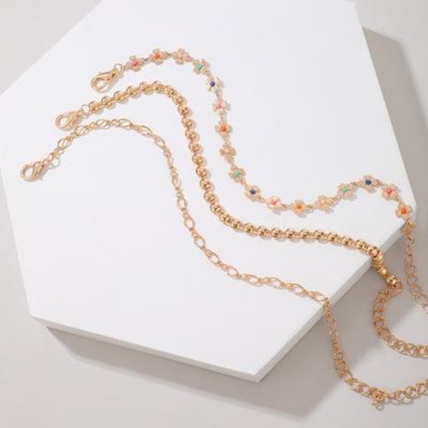 Set á 3 stk rhodiumpläterade armband med blommor i olika färger Guld one size