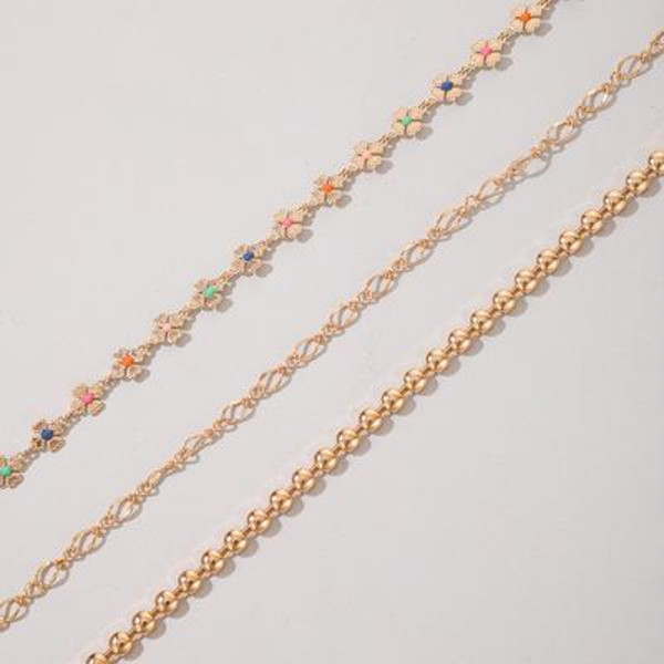 Set á 3 stk rhodiumpläterade armband med blommor i olika färger Guld one size