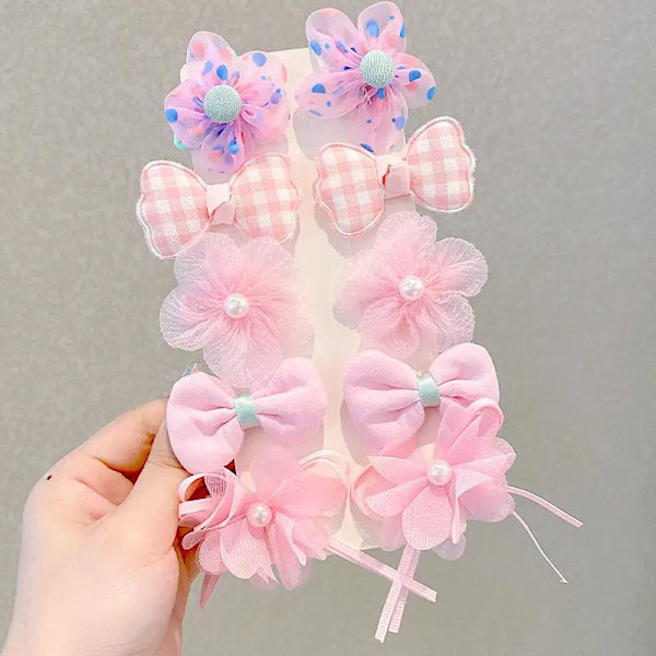 Sarja värikkäitä rusetteja hiusklipsikukkia ja helmiä Pink one size