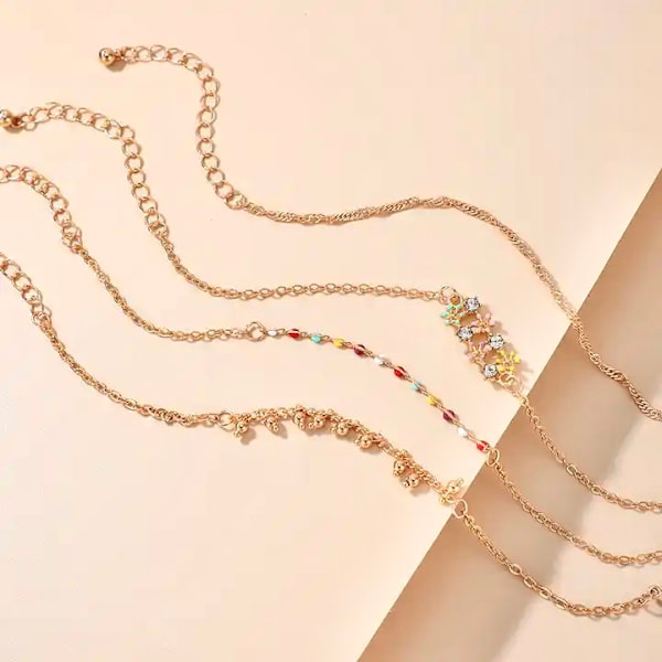 Set á 4 stk orientaliska rhodiumpläterade armband med stenar smycken Guld one size